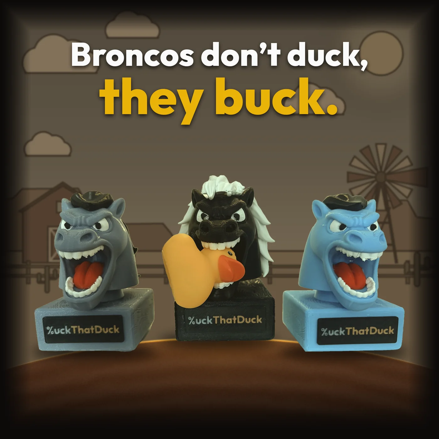 Three Bronco Buck figurines in gray, black and light blue on %uckThatDuck nameplate stands, the black one biting a rubber duck, under the tagline Broncos don't duck, they buck.